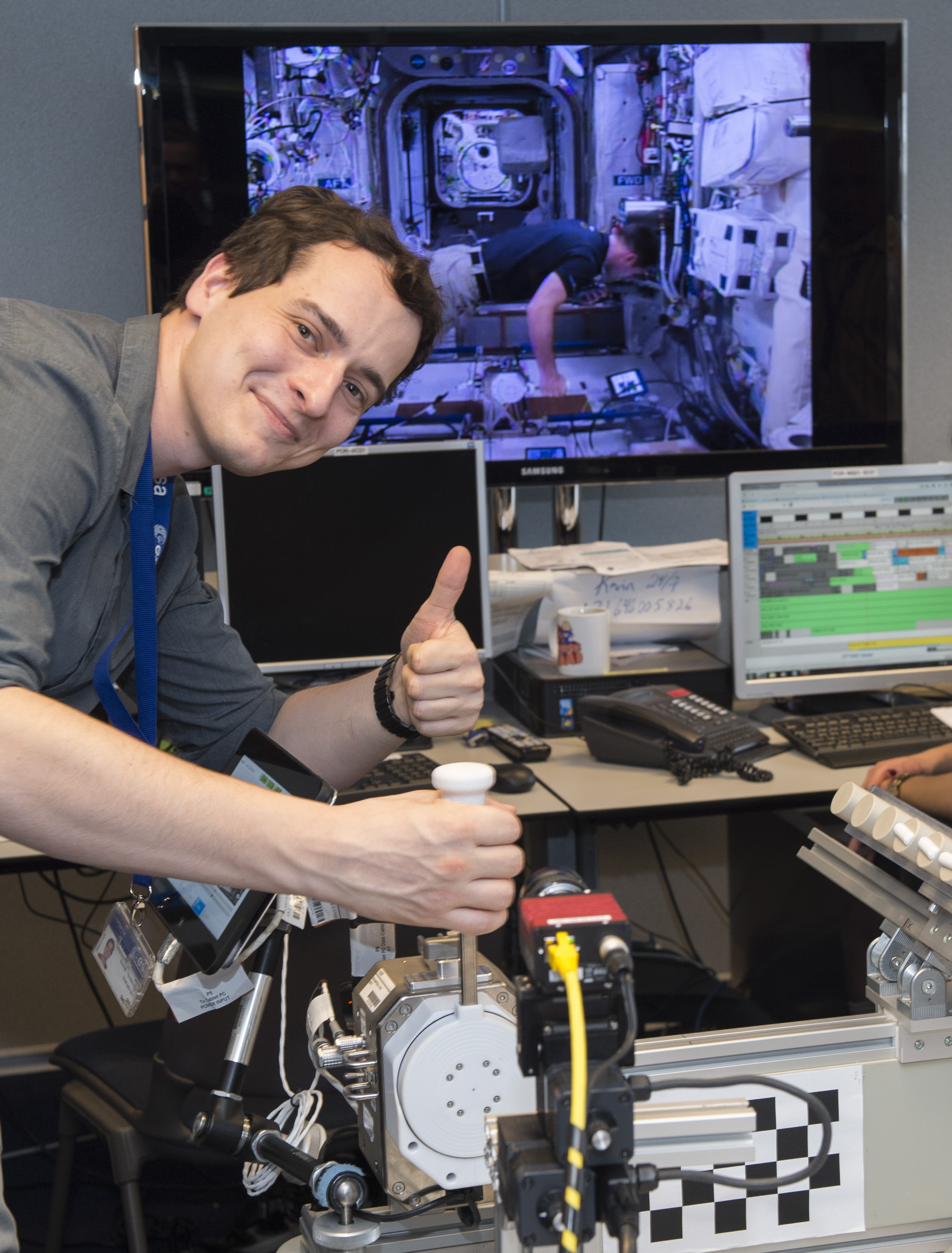 Jan Smisek at the haptic joystick during the Haptics-2 experiment with ISS live feed